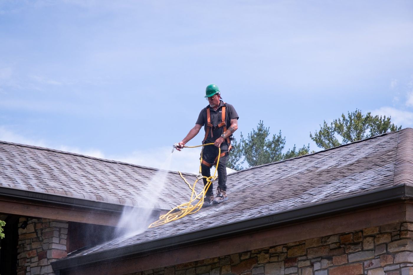 Roof Maxx technician applying treatment in Chicago