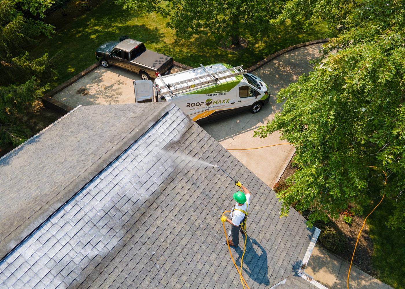 Roof Maxx treatment being applied to a home in Columbus